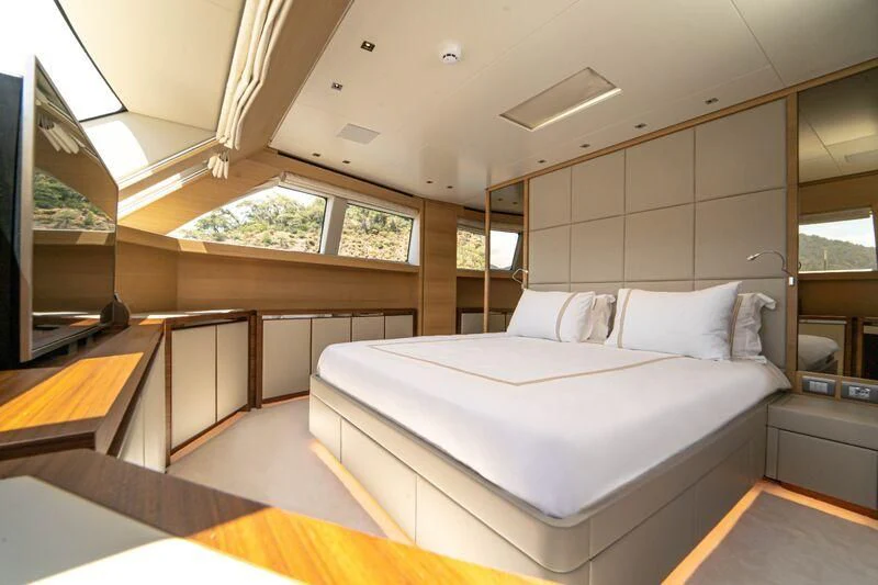 a room with a bed and a window aboard SOUTH SEA Yacht for Sale