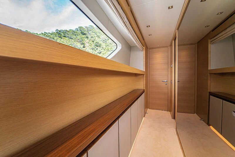 a room with wooden furniture aboard SOUTH SEA Yacht for Sale