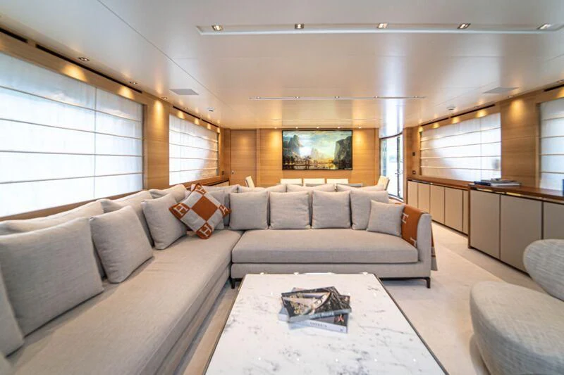 a living room with a large sofa aboard SOUTH SEA Yacht for Sale