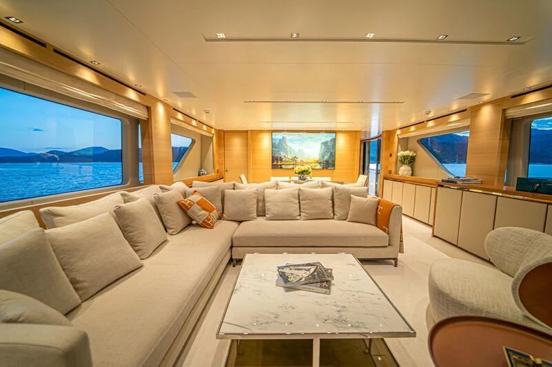 a living room with a large sofa aboard SOUTH SEA Yacht for Sale