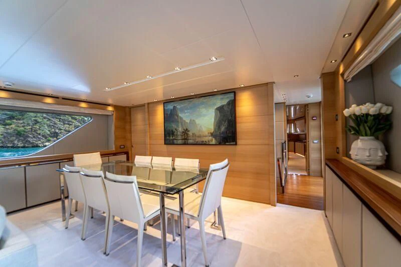 a room with a table and chairs aboard SOUTH SEA Yacht for Sale