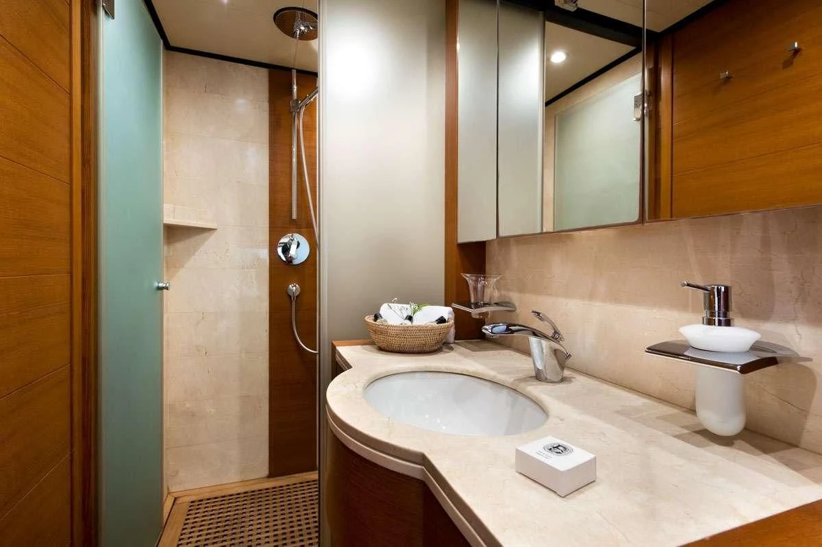 a bathroom with a sink and a mirror aboard LOANA Yacht for Sale