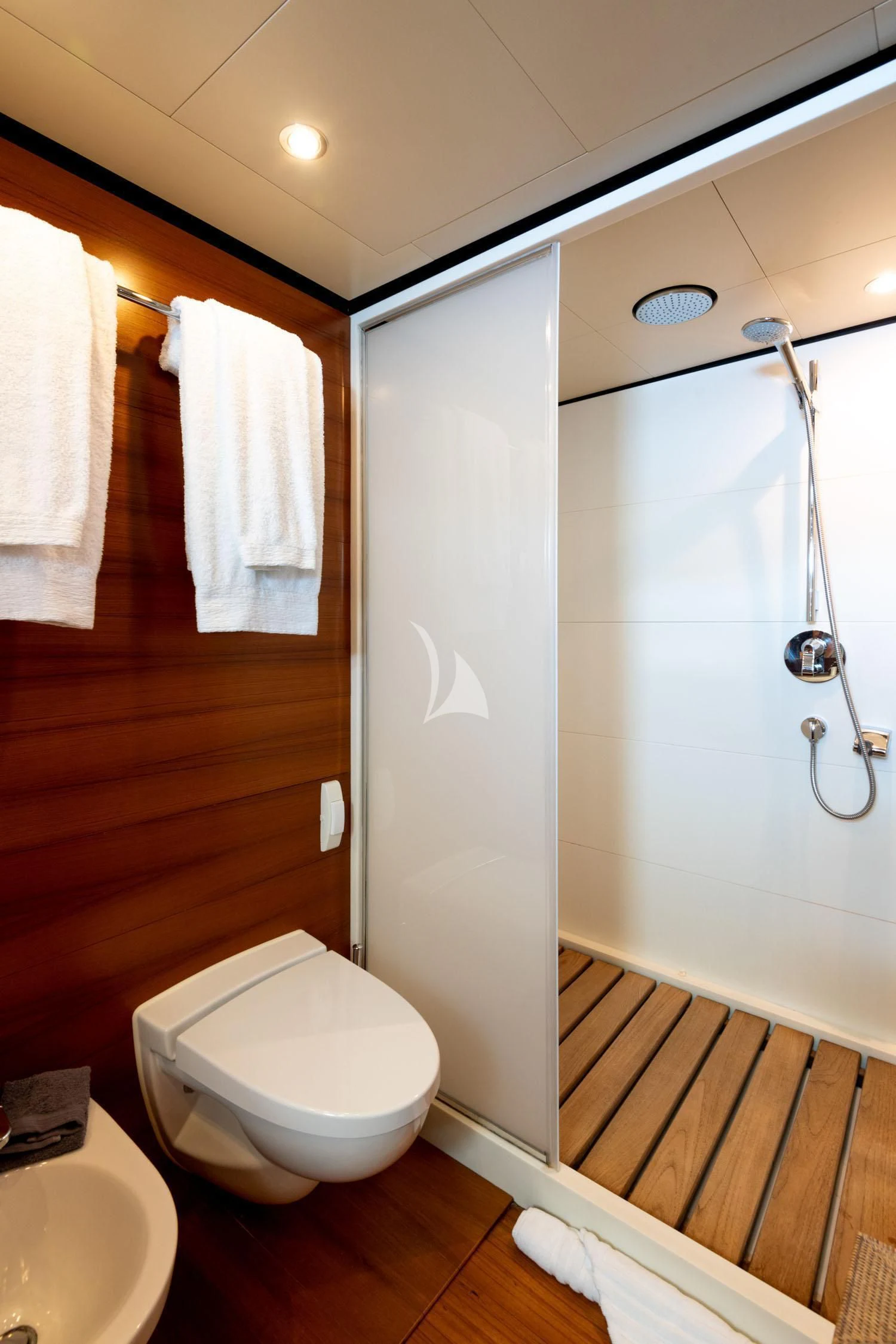 a bathroom with a toilet and a sink aboard LOANA Yacht for Sale