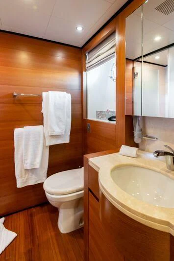 a bathroom with a toilet and sink aboard LOANA Yacht for Sale