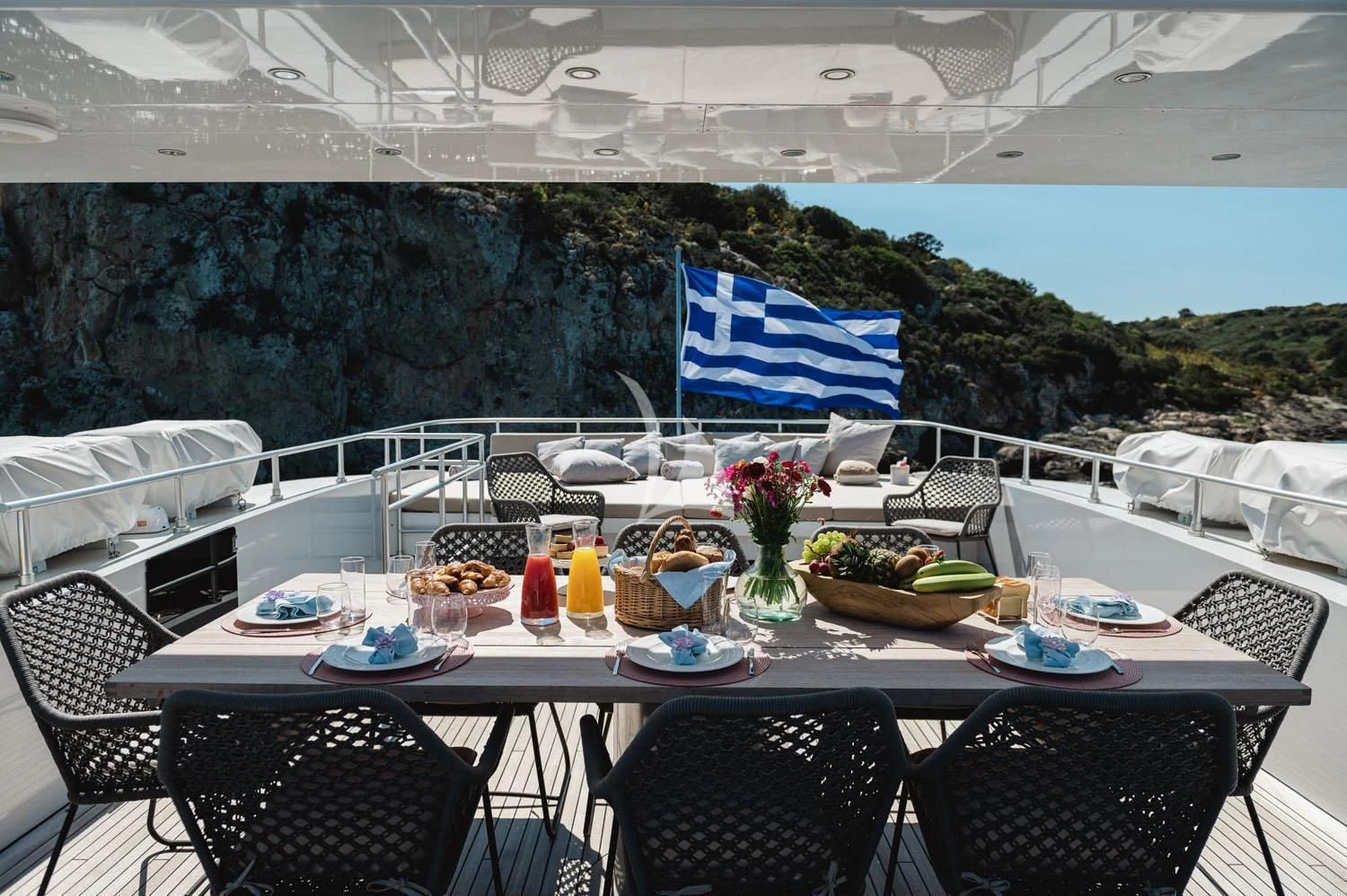 a table with food on it aboard LOANA Yacht for Sale