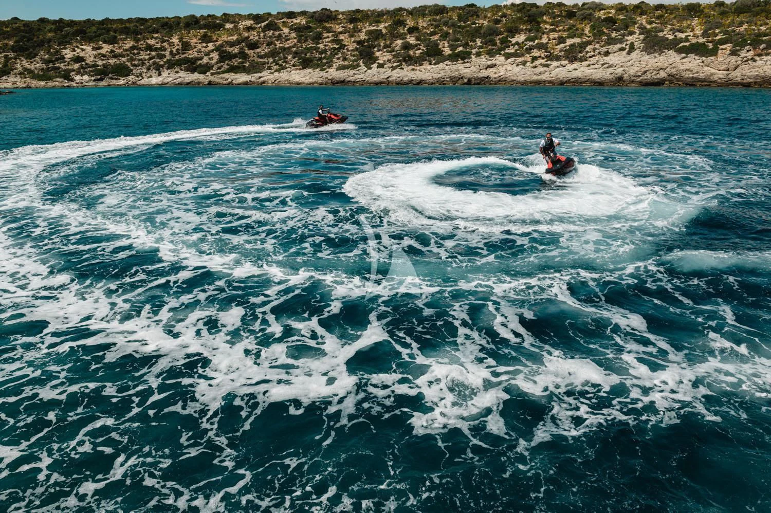 a person surfing in the sea aboard LOANA Yacht for Sale