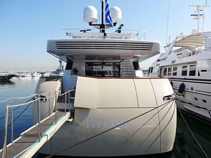 a large white boat in a harbor aboard LOANA Yacht for Sale