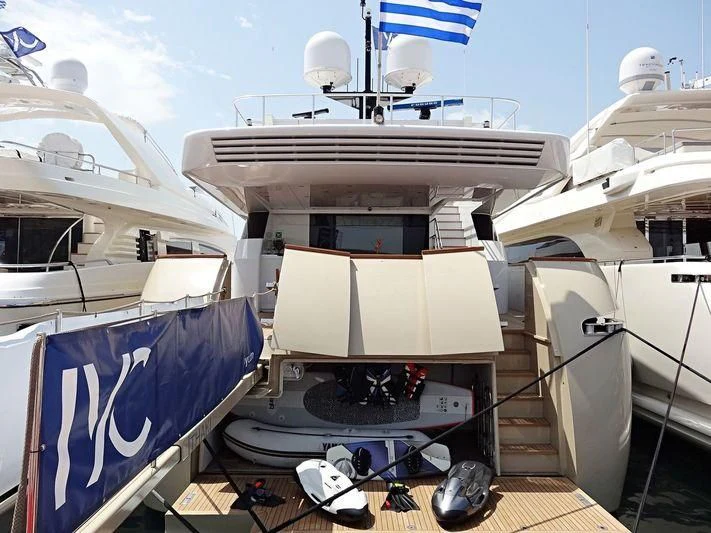 a large white ship with a flag on it aboard LOANA Yacht for Sale