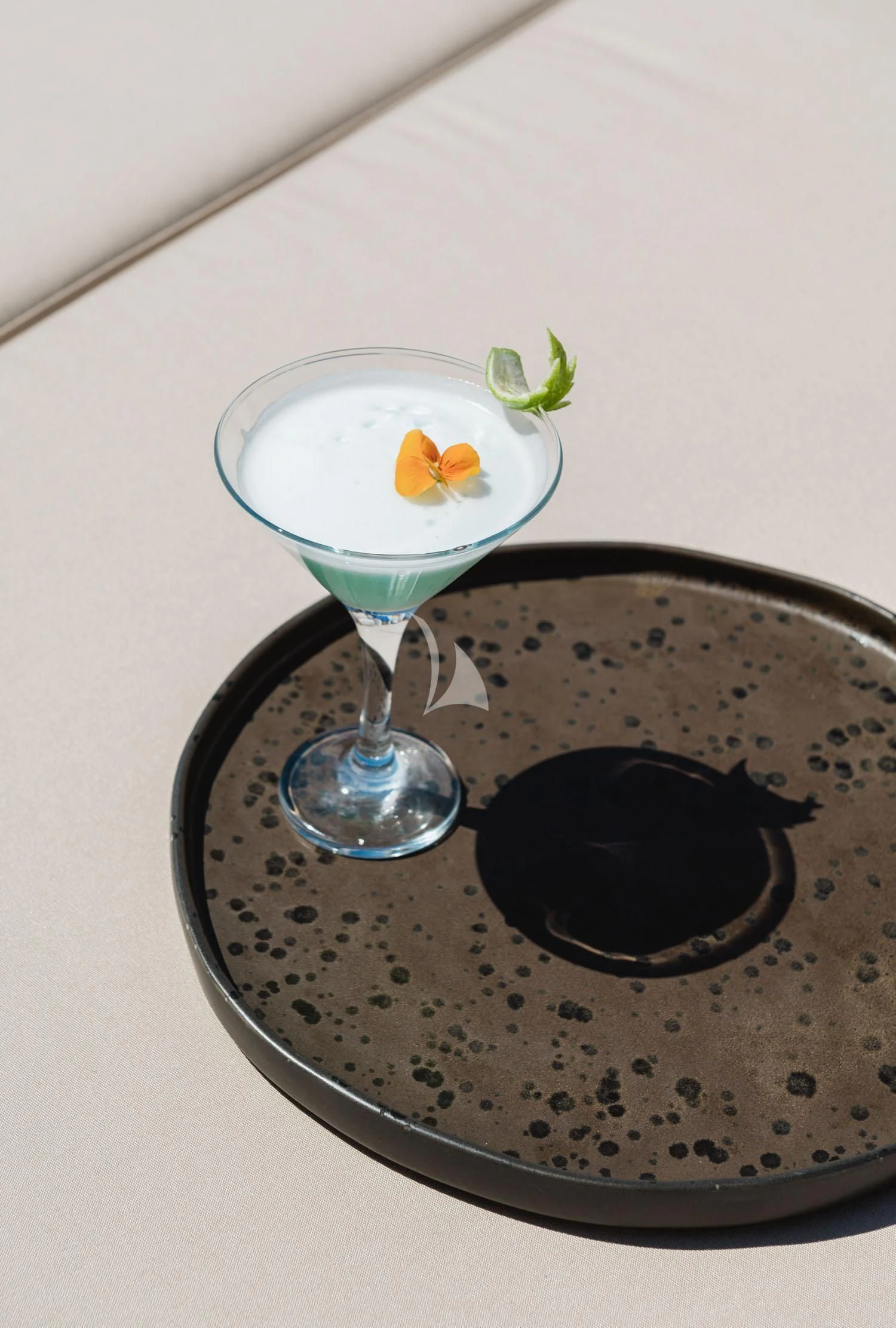 a glass of liquid and a plate of food aboard LOANA Yacht for Sale