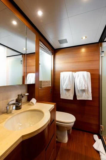 a bathroom with a sink and toilet aboard LOANA Yacht for Sale