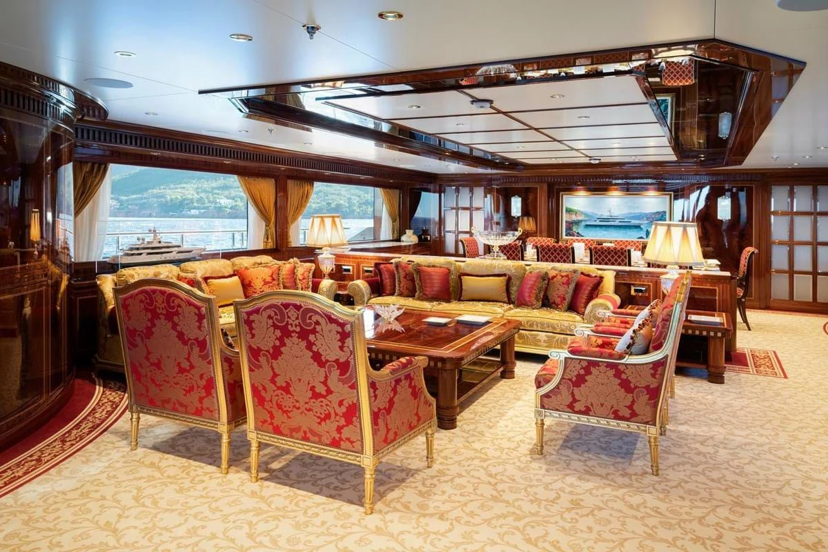 a living room with a couch and chairs aboard COCKTAILS Yacht for Sale