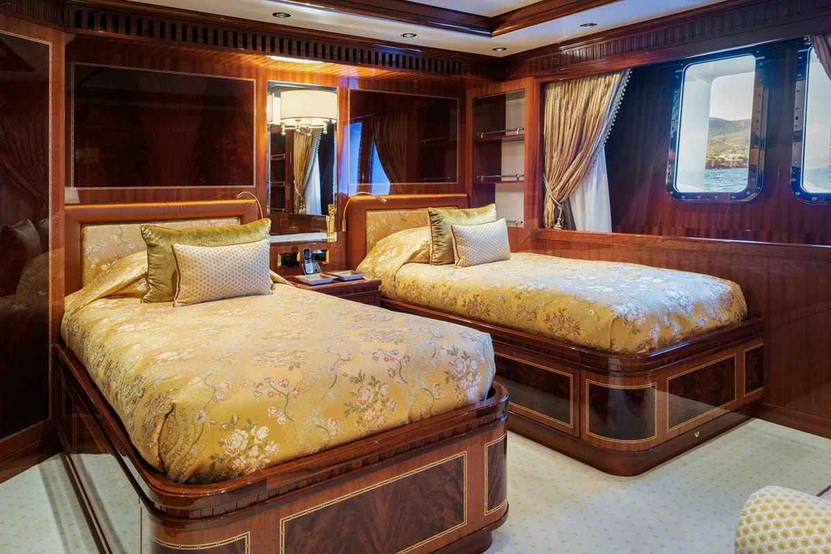 a couple of beds in a hotel room aboard COCKTAILS Yacht for Sale