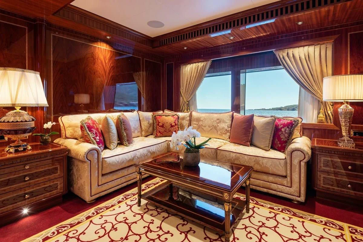 a living room with a large window aboard COCKTAILS Yacht for Sale
