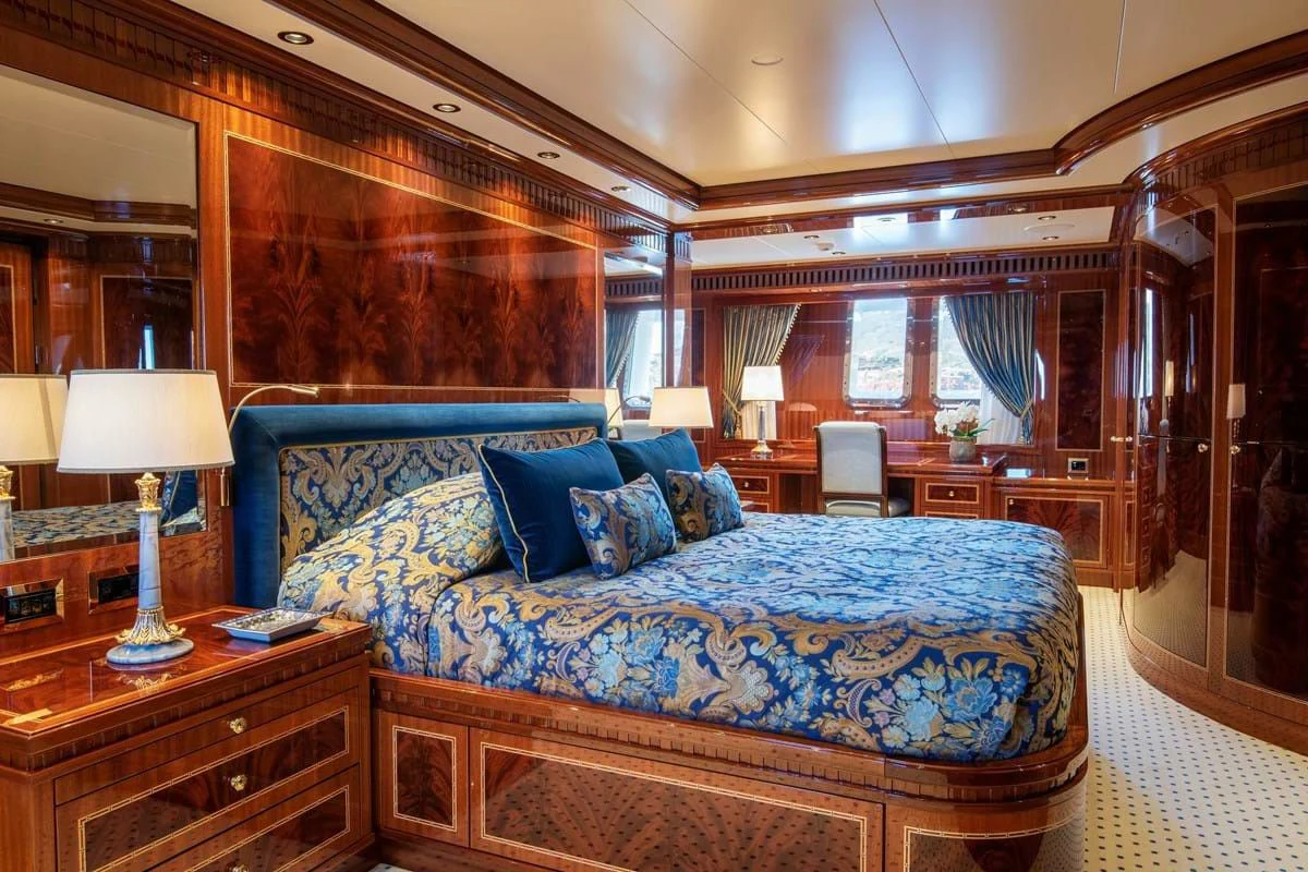 a large bed in a room aboard COCKTAILS Yacht for Sale