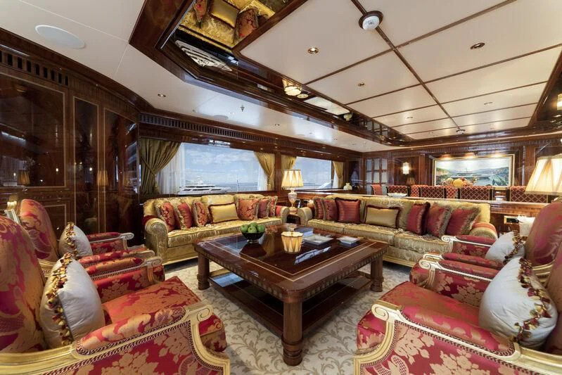 a living room with a large window aboard COCKTAILS Yacht for Sale