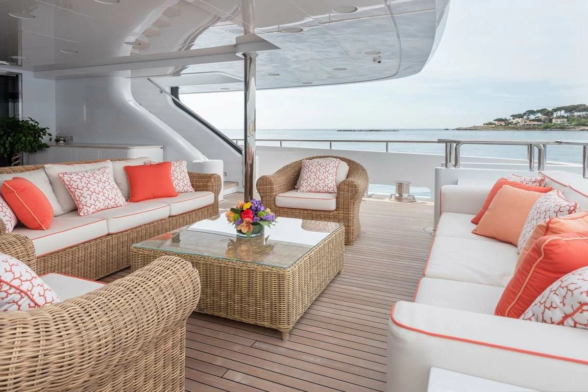 a living room with a table and chairs aboard COCKTAILS Yacht for Sale