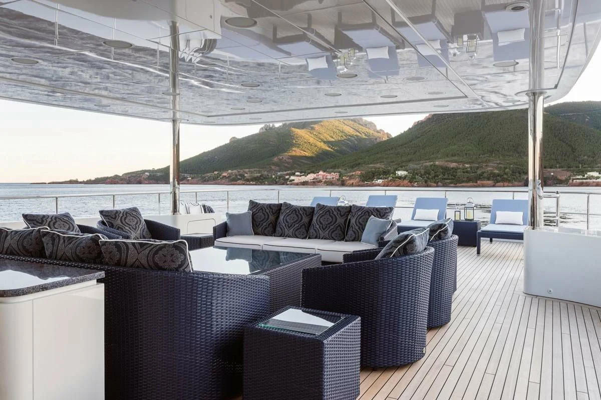 a large room with couches and chairs aboard COCKTAILS Yacht for Sale