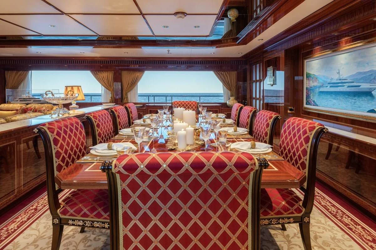 a restaurant with a table and chairs aboard COCKTAILS Yacht for Sale