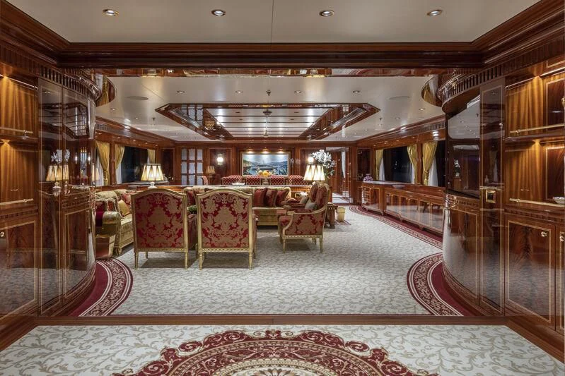 a large library with a few people aboard COCKTAILS Yacht for Sale