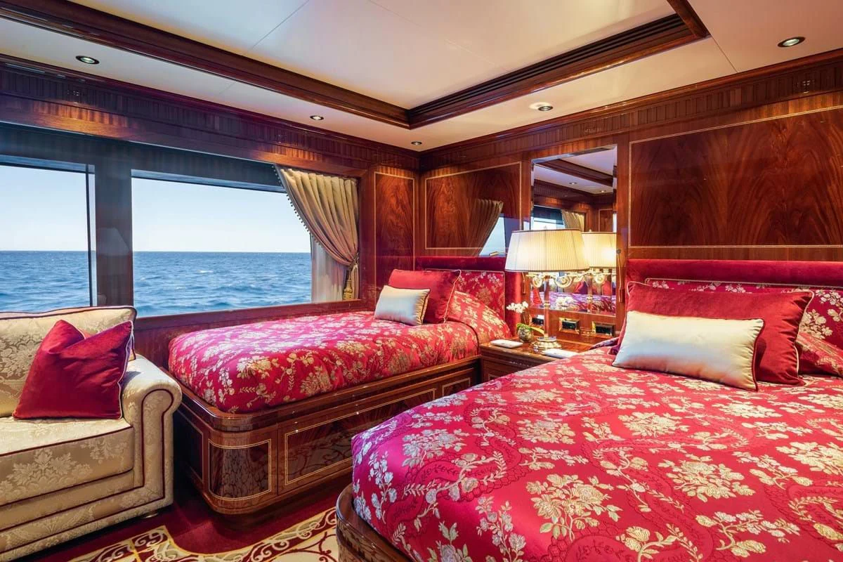 a room with a bed and a window aboard COCKTAILS Yacht for Sale