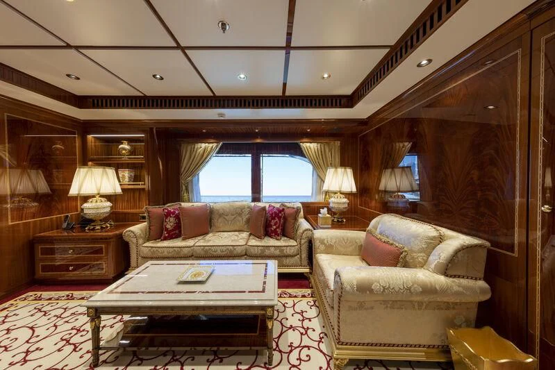 a living room with a large mirror aboard COCKTAILS Yacht for Sale