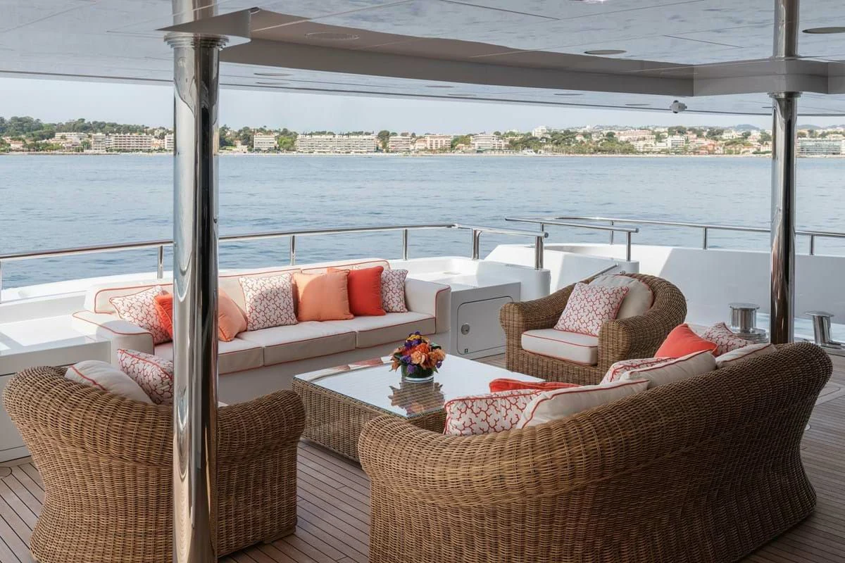 a living room with a large body of water aboard COCKTAILS Yacht for Sale