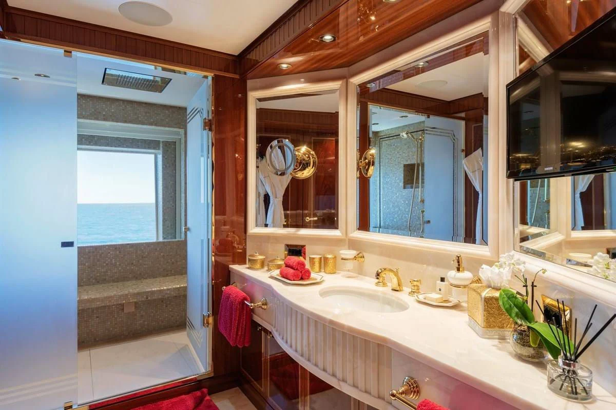 a bathroom with a large mirror aboard COCKTAILS Yacht for Sale