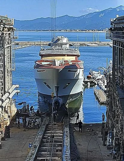 a boat docked at a pier aboard COCKTAILS Yacht for Sale