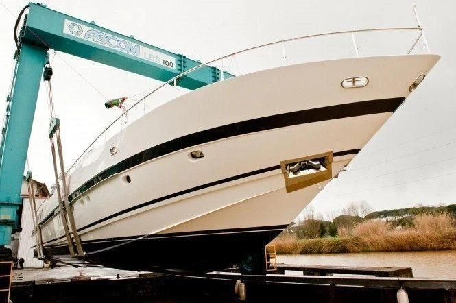 a white boat on a dock aboard ONTRAC Yacht for Sale