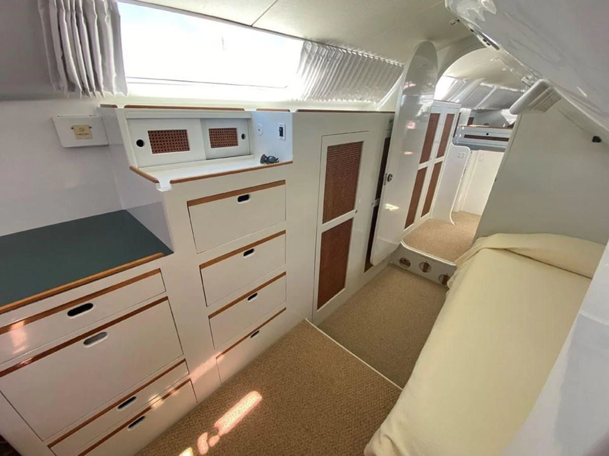 a small kitchen with white cabinets aboard ROUTE 66 Yacht for Sale