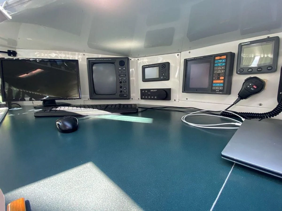 a group of computers on a table aboard ROUTE 66 Yacht for Sale