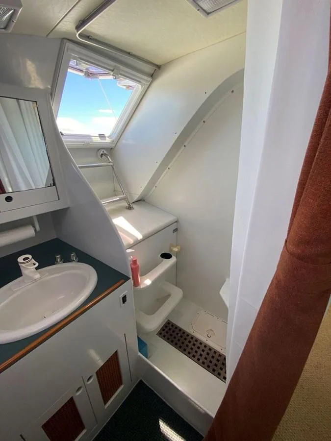 a bathroom with a sink and a toilet aboard ROUTE 66 Yacht for Sale