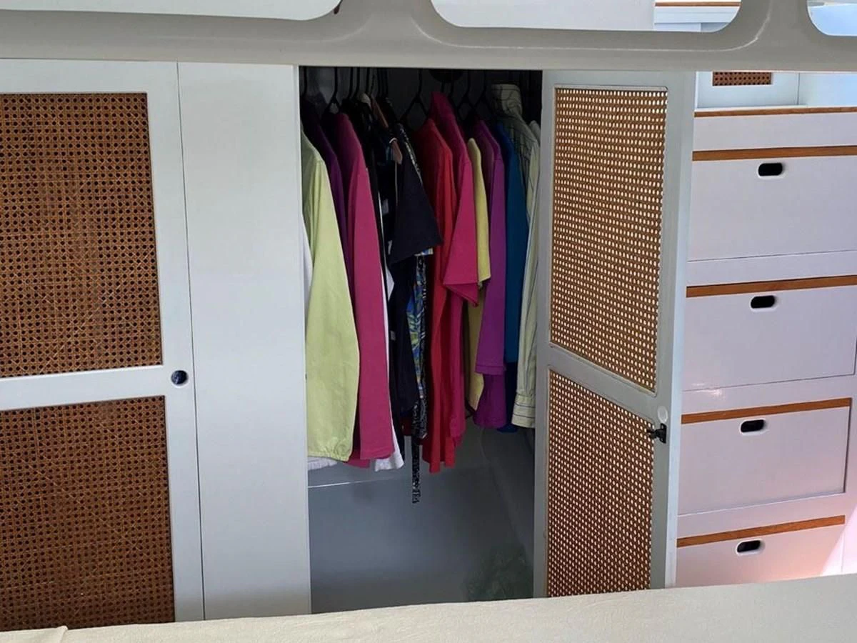 a closet with clothes on the wall aboard ROUTE 66 Yacht for Sale
