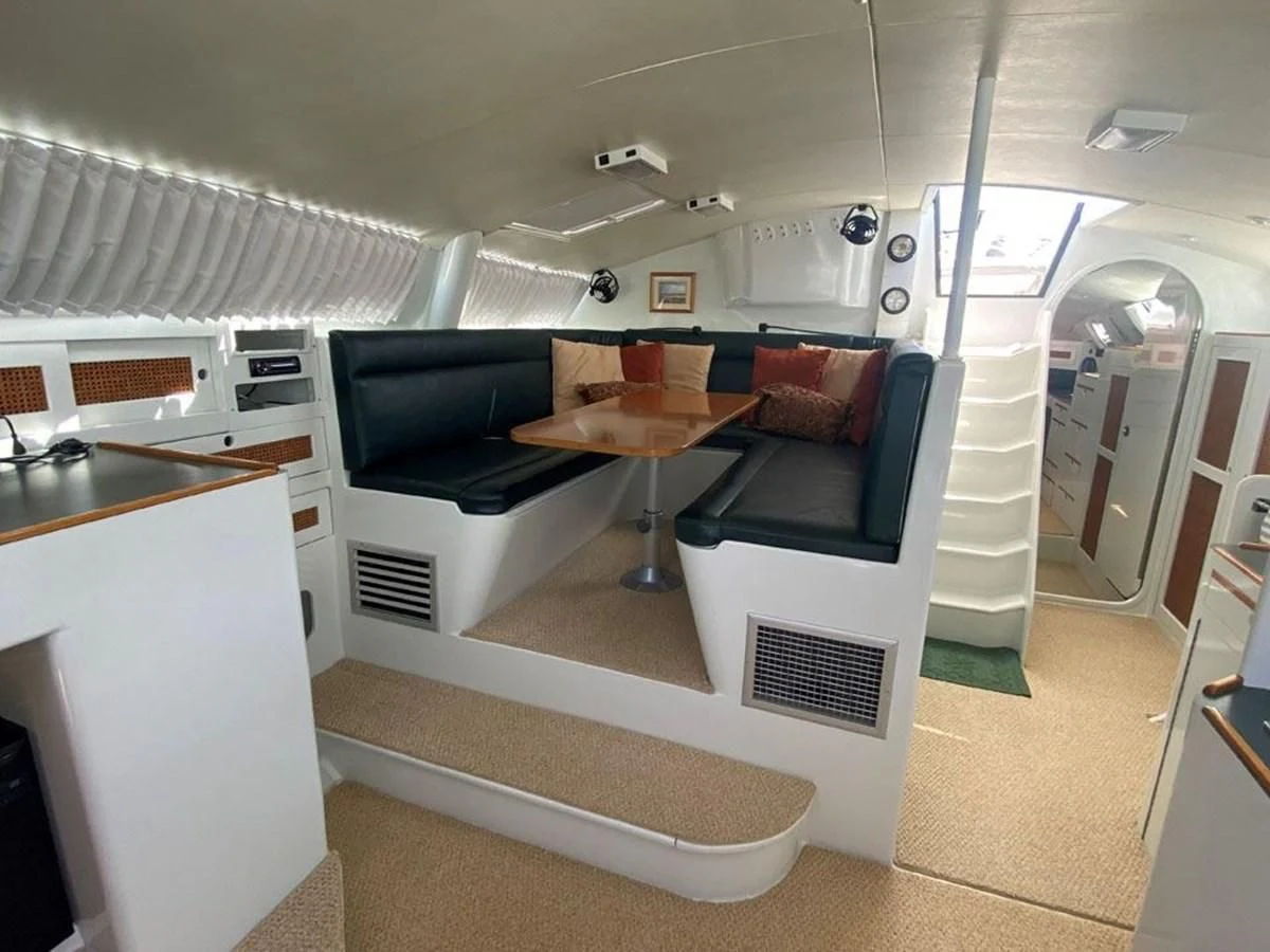 a small kitchen with a table aboard ROUTE 66 Yacht for Sale