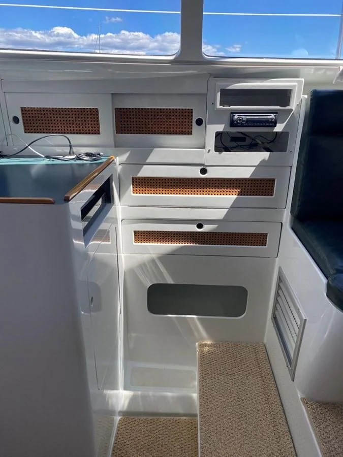 a white machine with a wood tray aboard ROUTE 66 Yacht for Sale