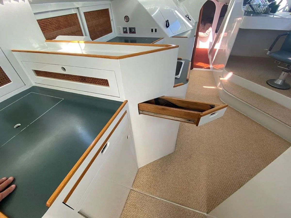 a kitchen with a sink and cabinets aboard ROUTE 66 Yacht for Sale