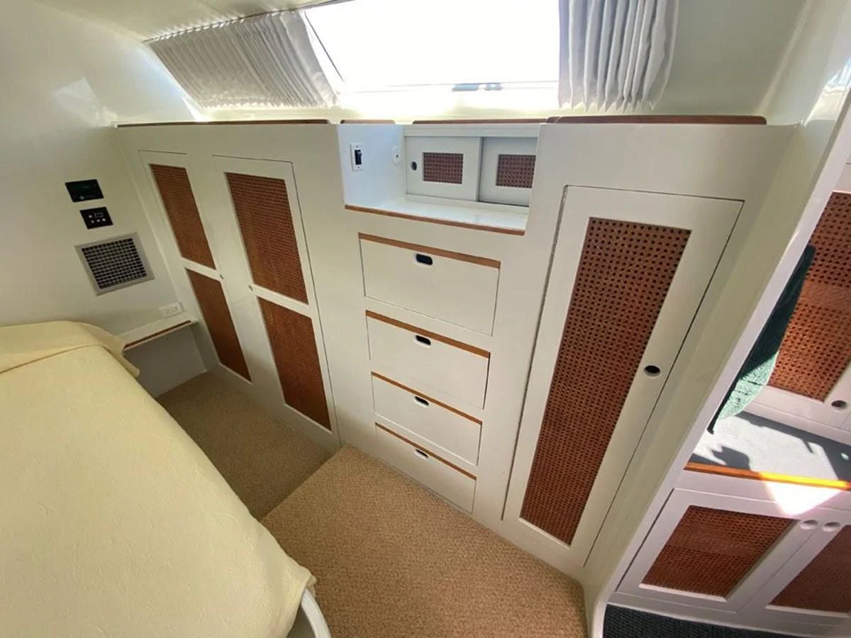 a room with a bed and a desk aboard ROUTE 66 Yacht for Sale