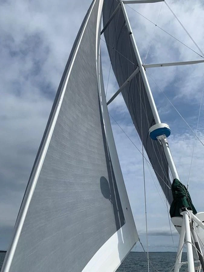 a large sailboat with a person on it aboard ROUTE 66 Yacht for Sale