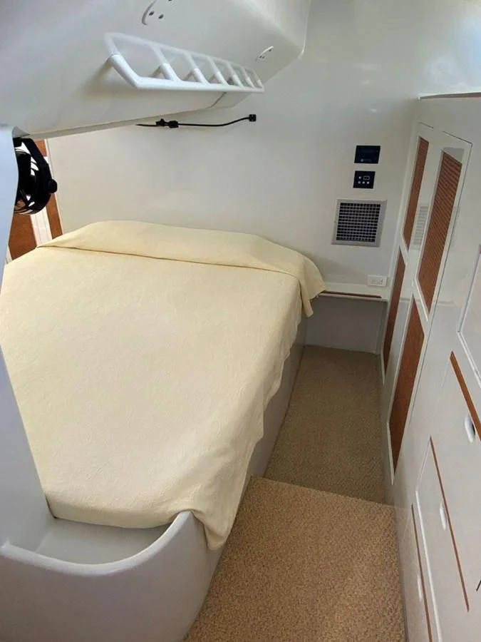a bedroom with a bed aboard ROUTE 66 Yacht for Sale