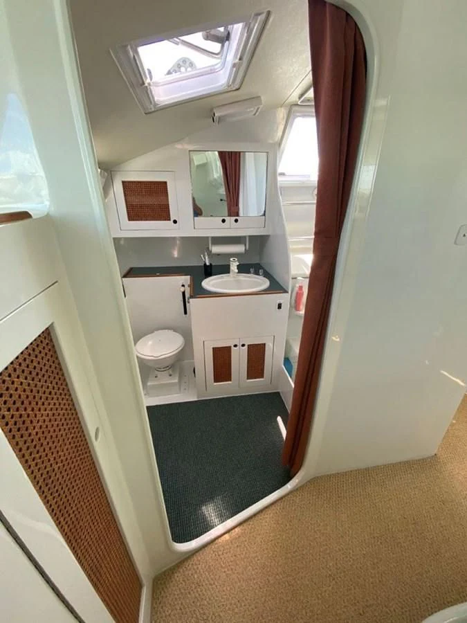 a bathroom with a sink and a toilet aboard ROUTE 66 Yacht for Sale