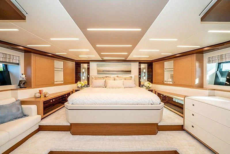 a large bedroom with a bed aboard VOYAGER Yacht for Sale
