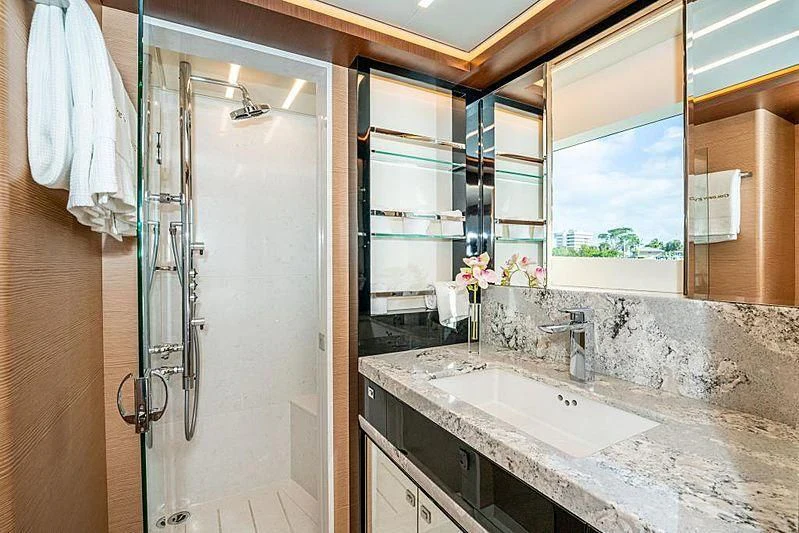 a bathroom with a large mirror aboard VOYAGER Yacht for Sale