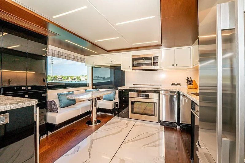 a kitchen with a large glass window aboard VOYAGER Yacht for Sale