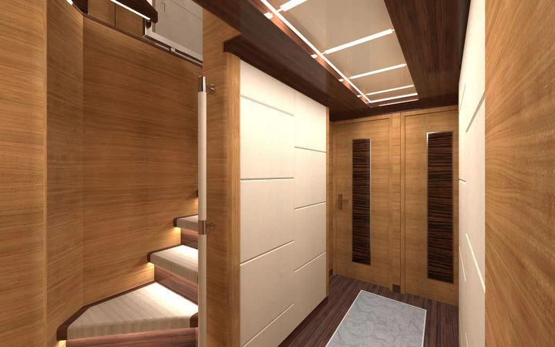 a room with wooden walls and a staircase aboard VOYAGER Yacht for Sale