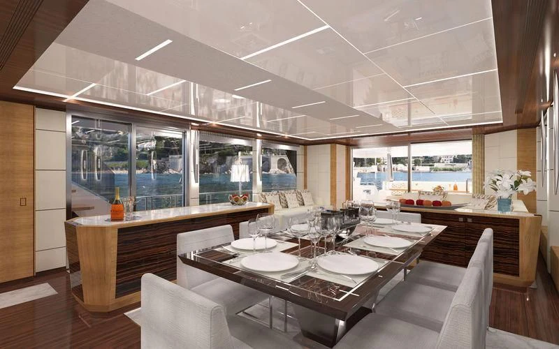 a room with a table chairs and a large window aboard VOYAGER Yacht for Sale