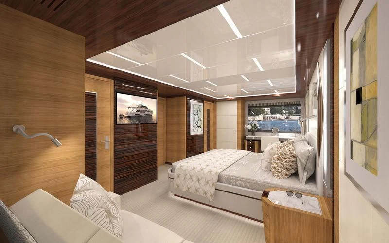 a room with a bed and a mirror aboard VOYAGER Yacht for Sale