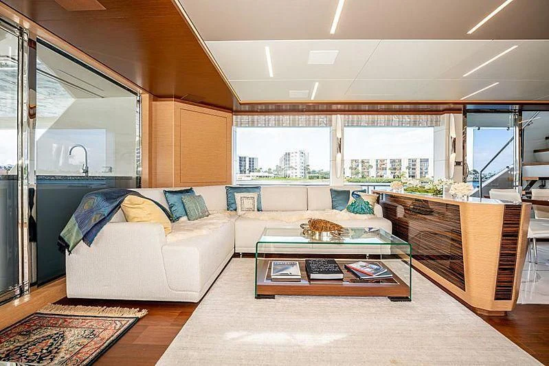 a living room with a couch and a coffee table aboard VOYAGER Yacht for Sale