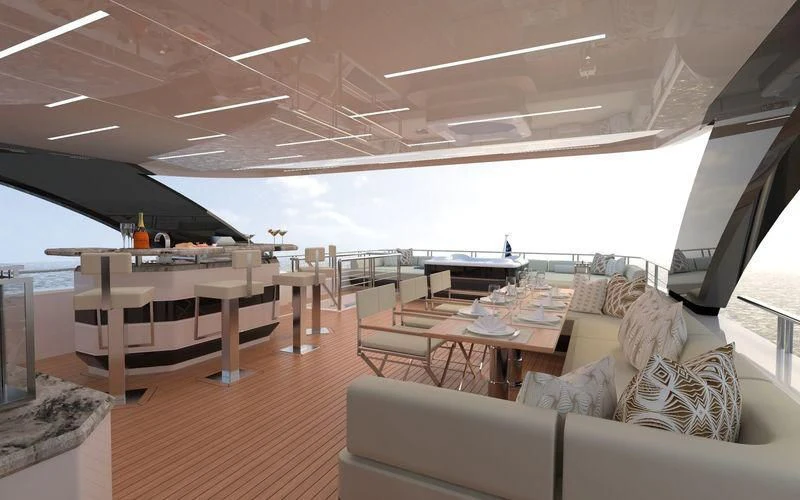 a room with a couch and a table and chairs aboard VOYAGER Yacht for Sale