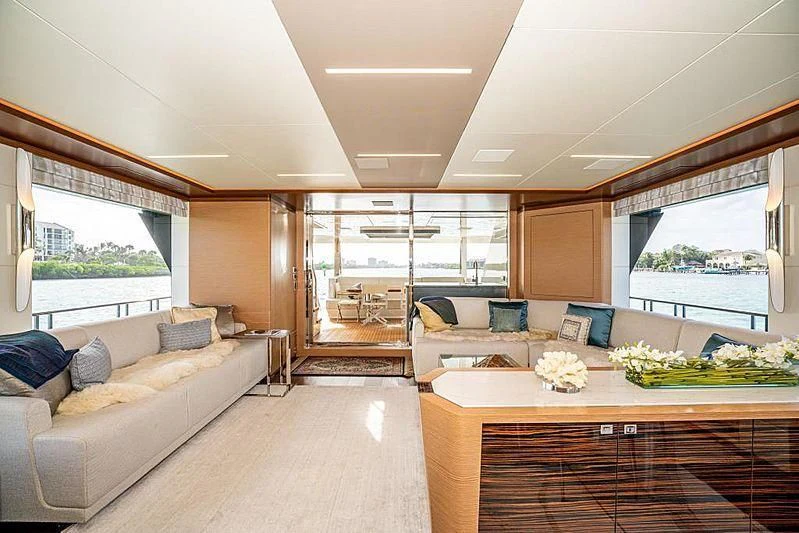 a living room with a large window aboard VOYAGER Yacht for Sale