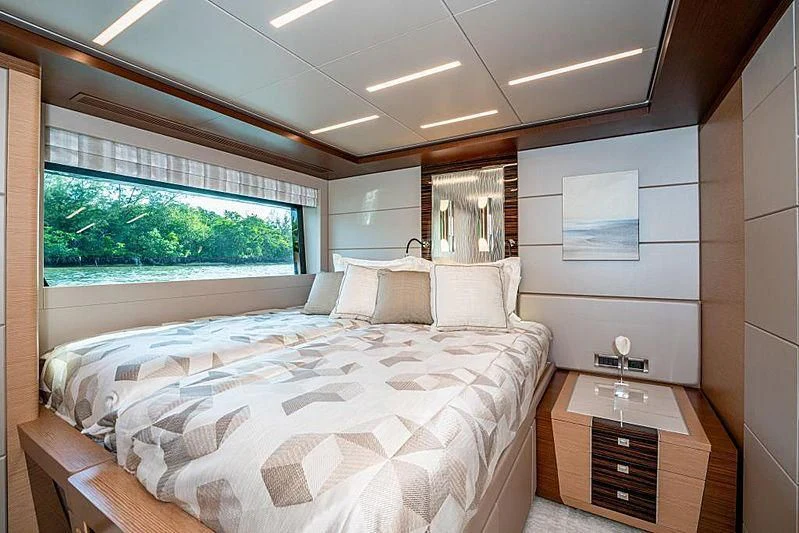a bedroom with a large bed aboard VOYAGER Yacht for Sale